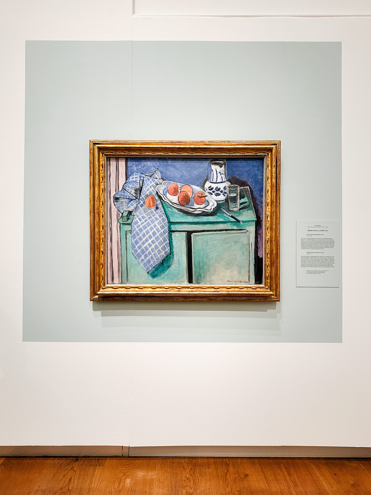 Still Life with Green Sideboard by Henri Matisse, 1928, with fruit, tableware and objects arranged against a green interior.
