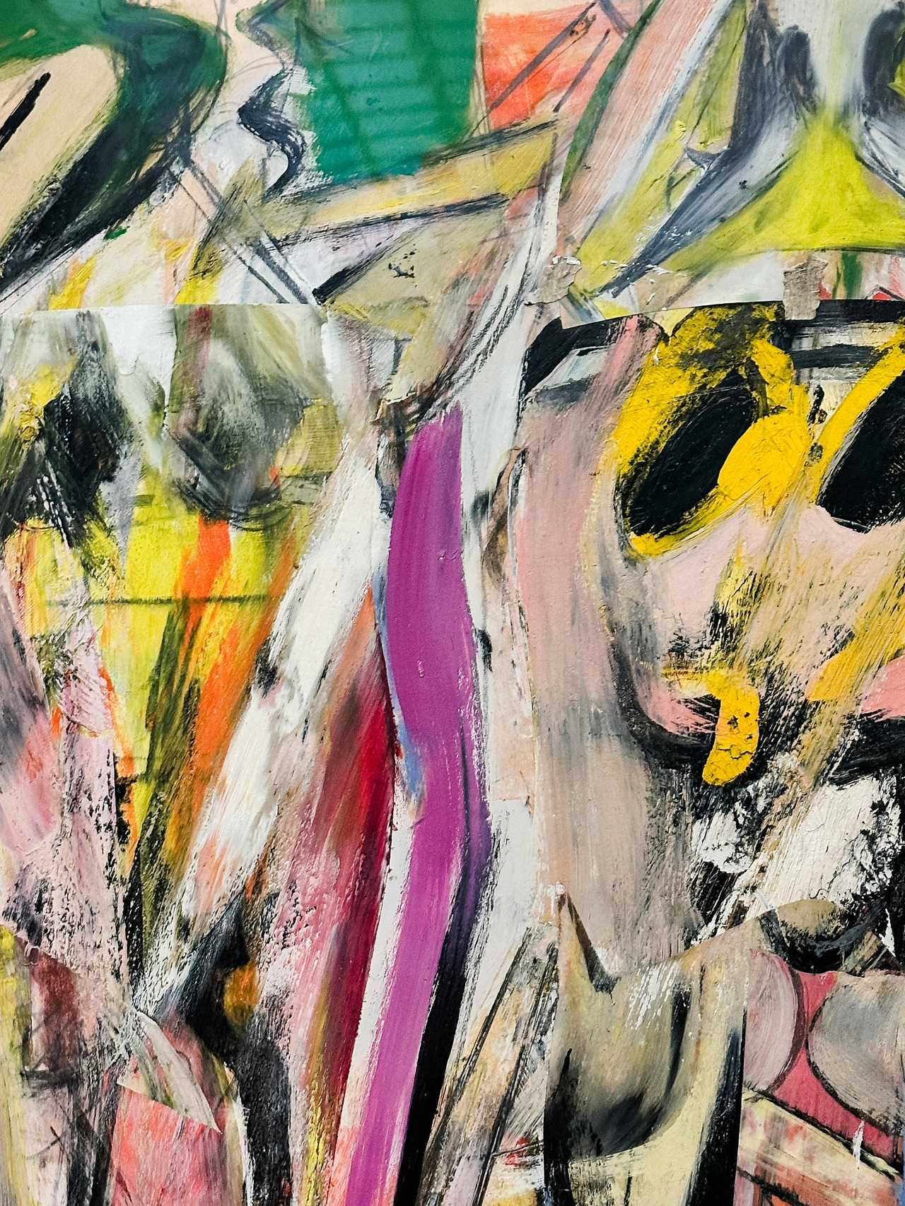 Close-up of a Willem de Kooning painting showing layered pink, yellow, green, black and white brushstrokes.