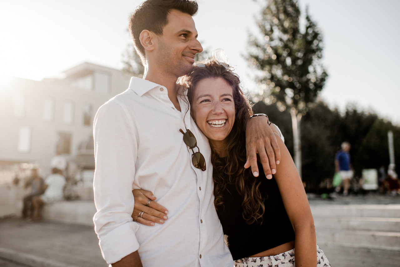 Happy couple newly engaged smiling in Lisbon Portugal