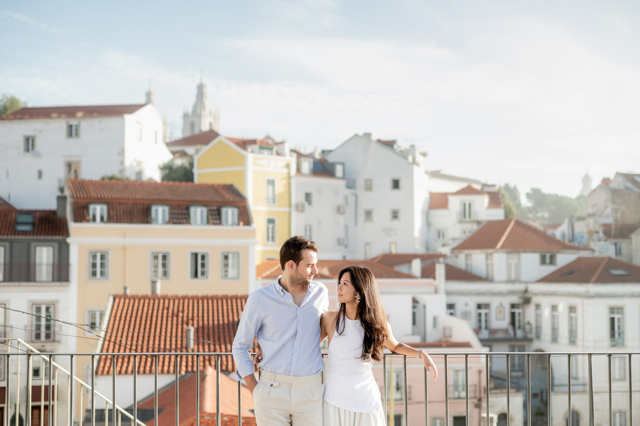 Proposal and engagement at Miradouro das Portas do Sol with terracotta rooftops and the city background