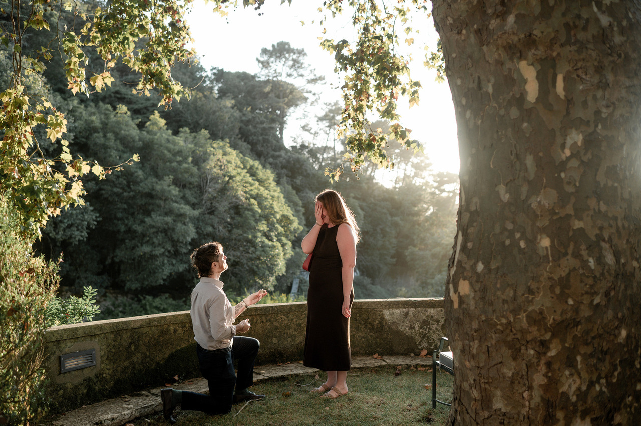 Surprise proposal at a viewpoint of Palácio de Seteais hotel in Sintra, Portugal